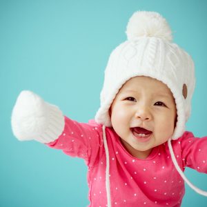 New born in warm clothes